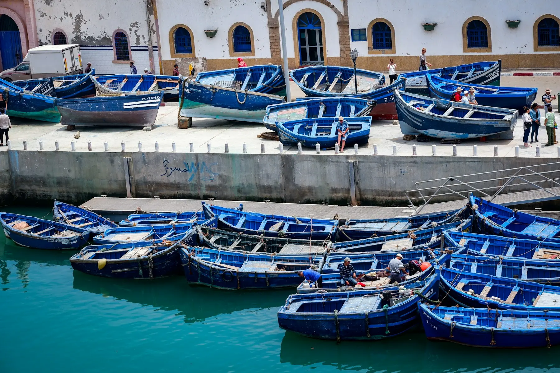 Blue wooden fishing boats in Essaouira harbour