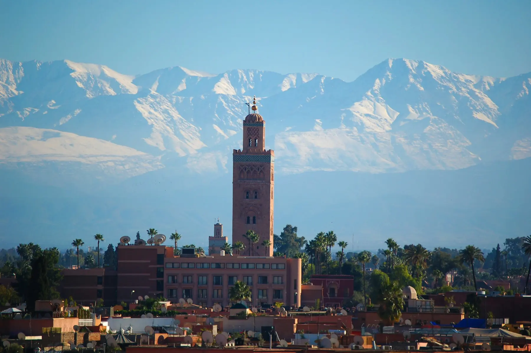 Koutoubia minaret in Marrakech with the snow-capped Atlas Mountains behind
